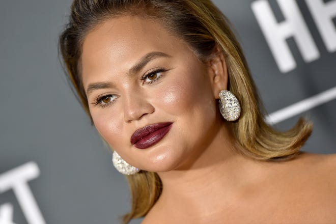 Chrissy Teigen shares that she still has some insecurities over her post-baby body.
