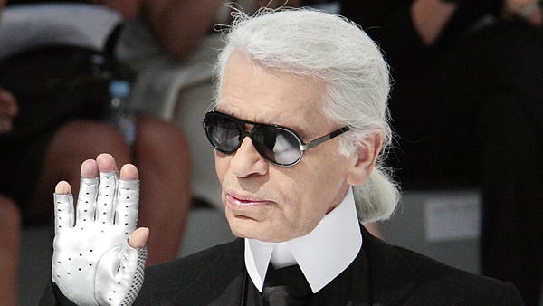 German designer Karl Lagerfeld acknowledges the...