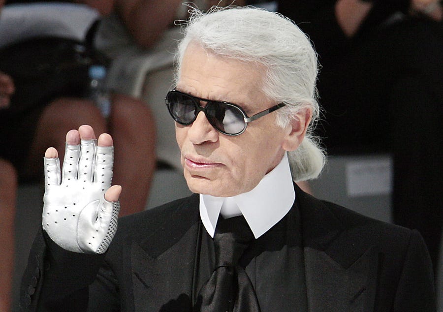 German designer Karl Lagerfeld acknowledges the public at the end Chanel Fall-Winter 2009 Haute Couture collection show in Paris on July 1, 2008.