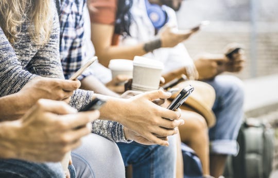 Multicultural friends group using smartphone with coffee at university college break - People hands addicted by mobile smart phone - Technology concept with connected trendy millennials - Filter image