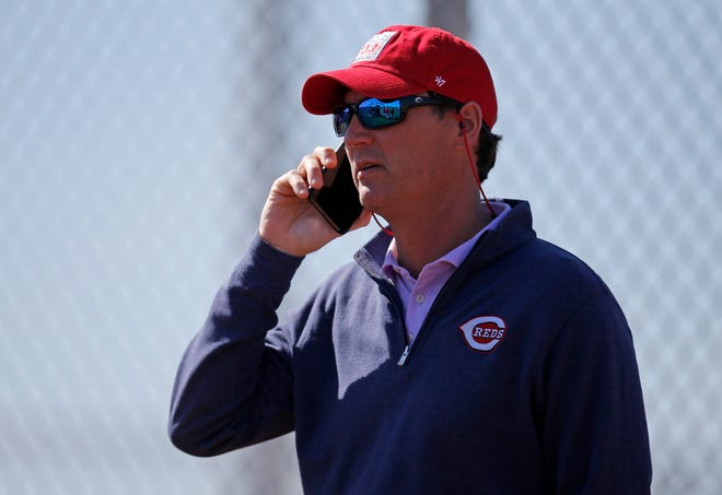 President of baseball operations Dick Williams talks on the phone at the Cincinnati Reds spring training facility in Goodyear, Ariz., on Wednesday, Feb. 20, 2019.