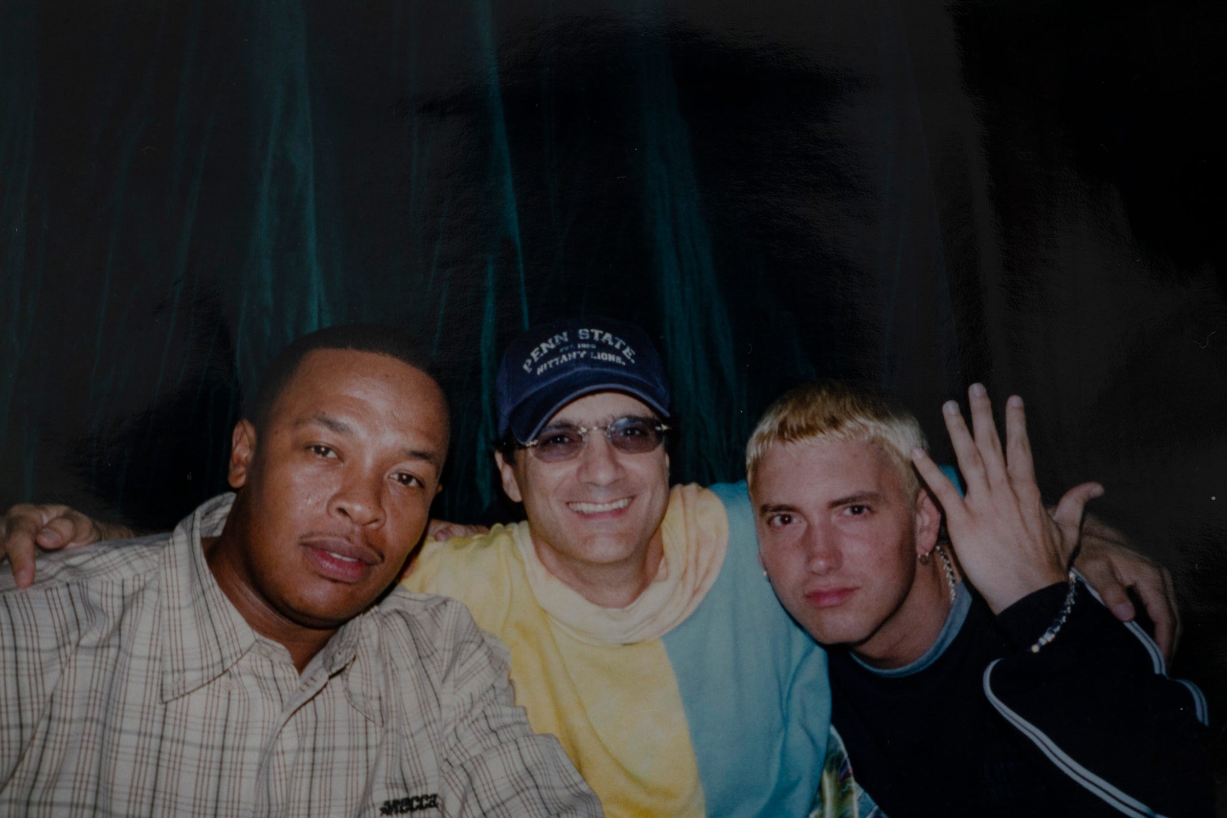 Dr. Dre, Jimmy Iovine and Eminem pose for a snapshot during a party in 1999.