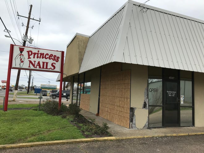 Princess Nails has been boarded up since a pickup truck plowed through the building last week.