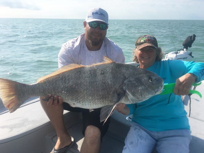 Becky Beatty with a nice stud drum while fishing with Capt. Christian Sommer.