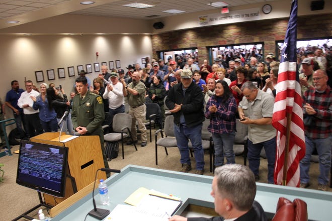 Crowds filled the San Juan County Commission chambers today as Sheriff Shane Ferrari presented a resolution stating the Sheriff's Office will not enforce certain gun control legislation.