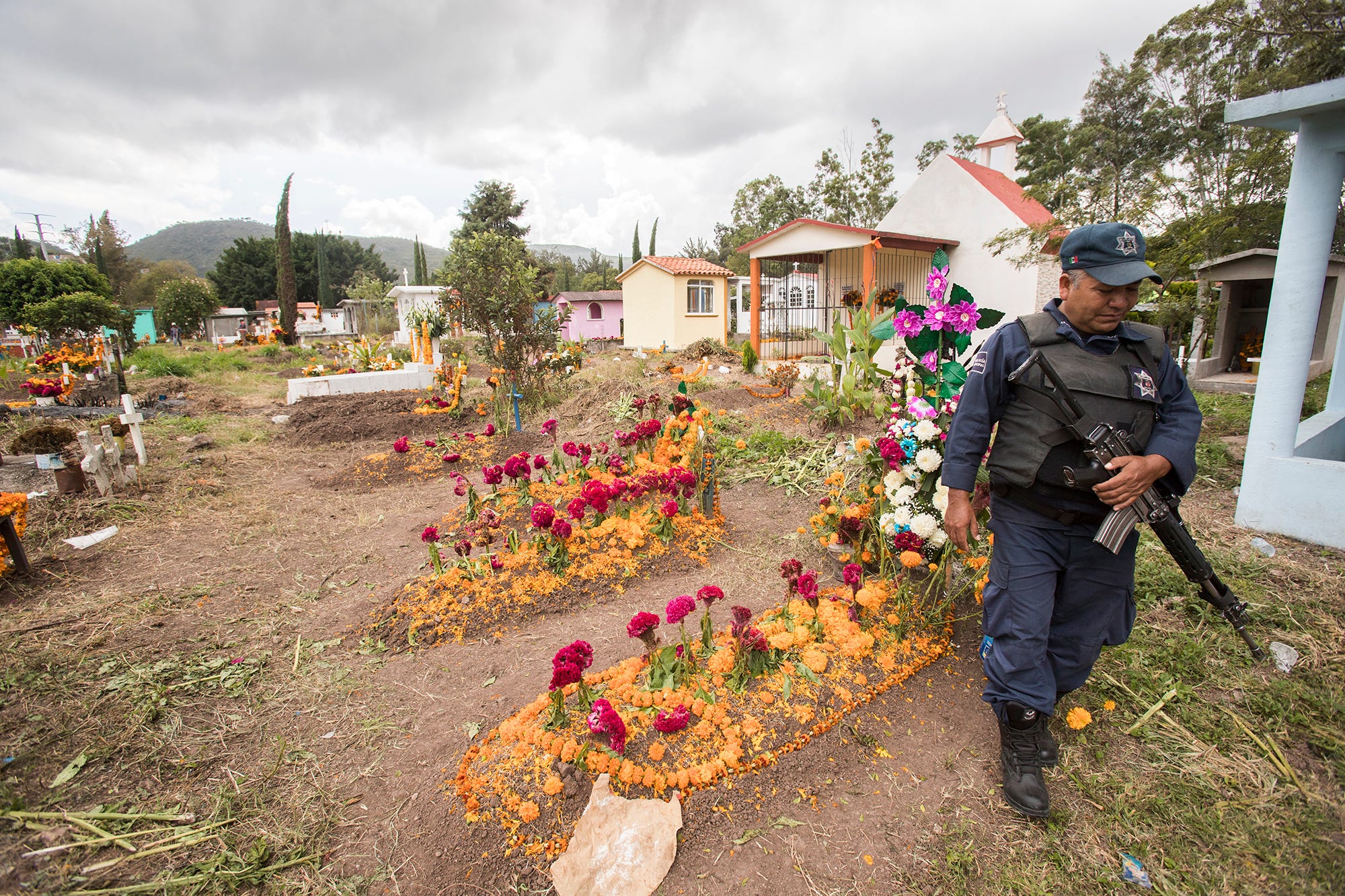 Chilapa has one of the highest homicide rates in the country. The police patrol the municipal cemetery on Day of the Dead.