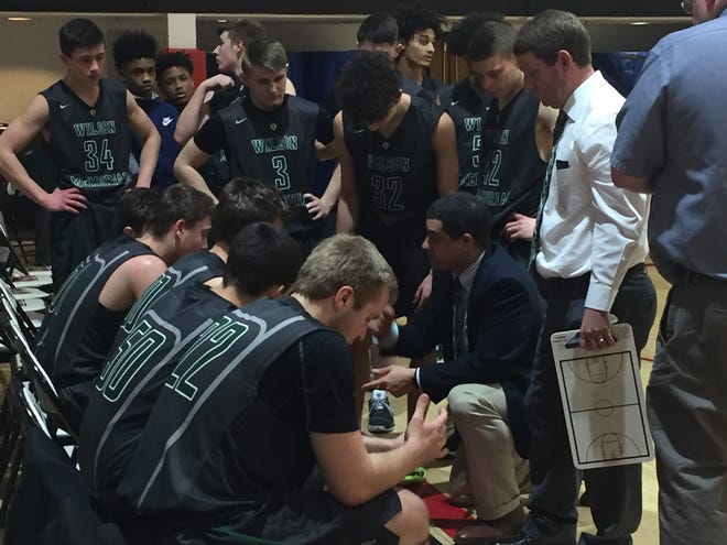 Wilson Memorial coach Jeremy Hartman talks with his team Tuesday during a timeout in the Region 2B quarterfinals at George Mason.