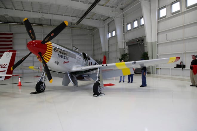 A P-51 C Mustang plane, flown by the Tuskegee Airmen in World War II is on display in the Flightline hangar at the Tallahassee International Airport as part of the RISE ABOVE: Red Tail Traveling Exhibit.