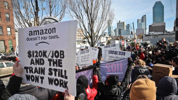 Anti-Amazon protesters in Long Island City,...