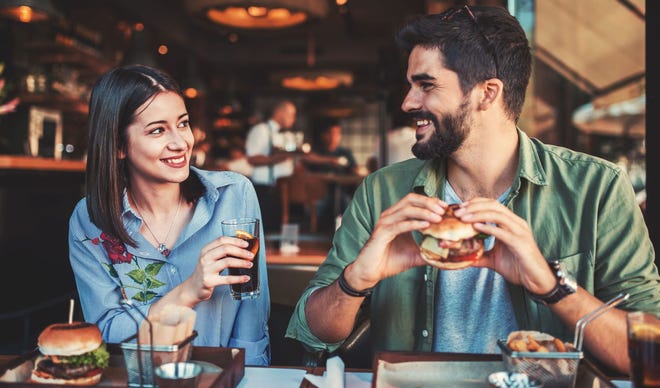 Sitting side-by-side makes conversation easier in noisy restaurants, plus it makes holding hands easier.