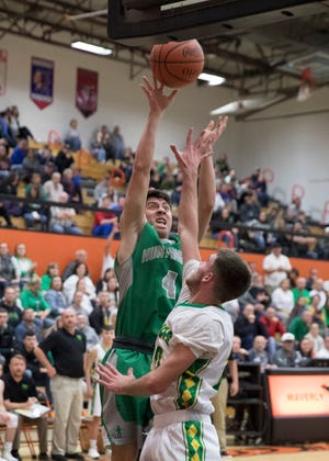 Huntington's Seth Beeler puts up a shot during a Division III sectional semifinal game in Waverly, Ohio in the 2018-19 season.