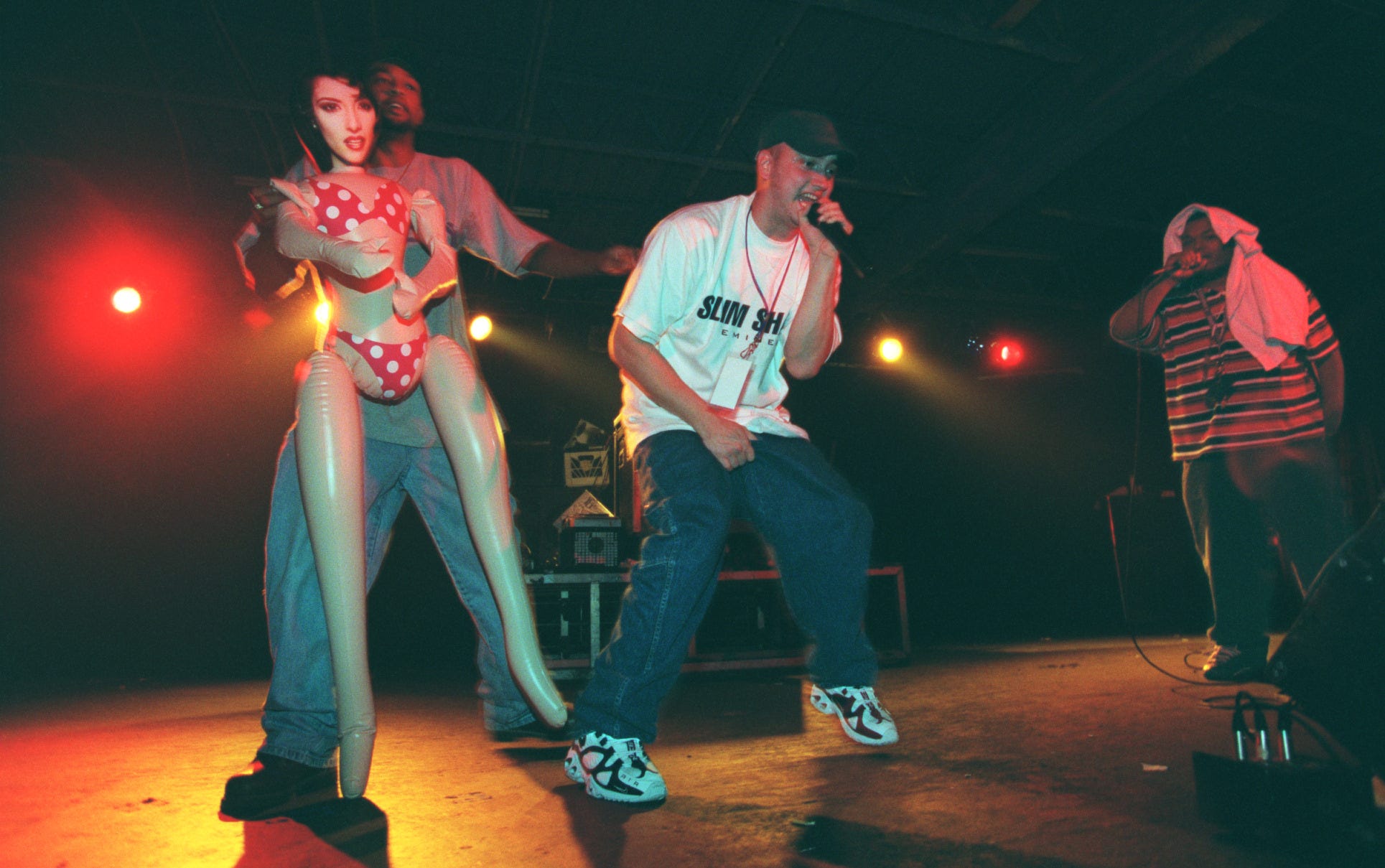 Eminem, center, is flanked by Mr. Gill of the Levels, left with doll, and Bizarre on Sept. 26, 1997, at the Palladium in Roseville, Mich.