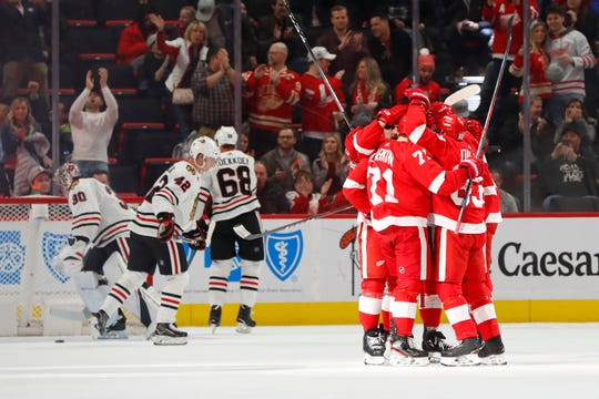 Detroit Red Wings center Dylan Larkin (71) celebrates his goal against the Chicago Blackhawks in the first period of an NHL hockey game Wednesday, February 20, 2019 in Detroit.