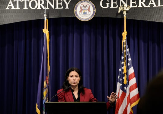 Attorney General Dana Nessel answers questions from reporters during a press conference Thursday morning in Lansing.