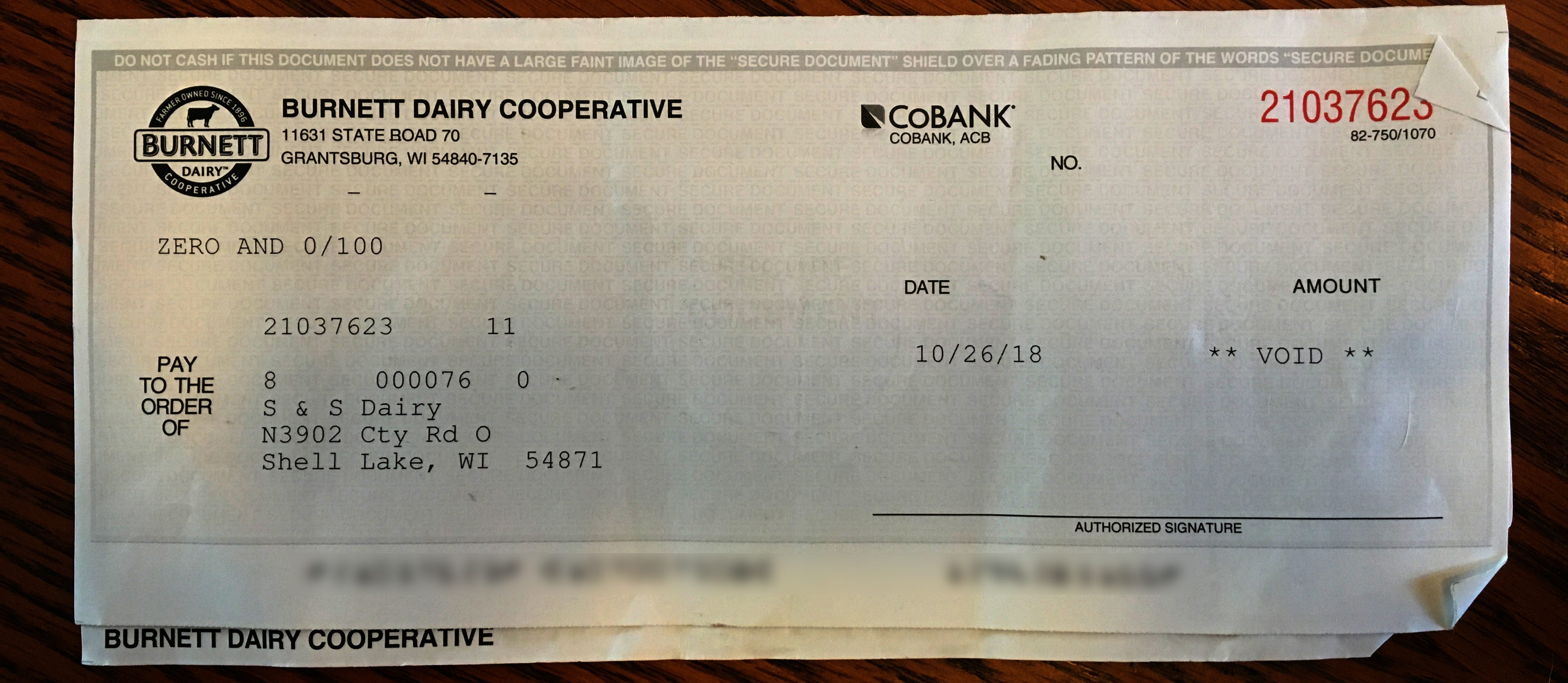 A check from the dairy cooperative is shown voided because the bank has first dibs on money from the milk sold by S & S Dairy.