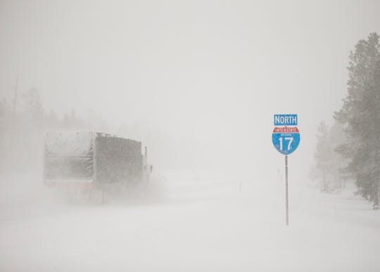 Snow falls over Interstate 17 near Flagstaff on Feb. 21, 2019.