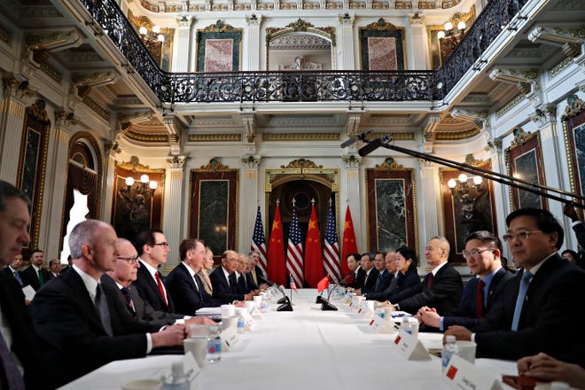 U.S. and Chinese delegations meet in the Indian Treaty Room in the Eisenhower Executive Office Building on the White House complex, during continuing meetings on the U.S.-China bilateral trade relationship, Thursday, Feb. 21, 2019, in Washington.