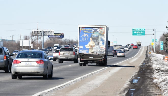 Motorists travel northbound along I-75 at 14 Mile in Troy. Drivers would get to choose their level of personal injury medical protection under competing Michigan House and Senate no-fault auto insurance reform plans.