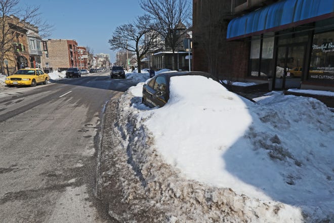 February 22, 2019 Parked car buried in snow yet almost a week since last snow started.  Its located in the 1400 block of North Farwell Avenue in Milwaukee.