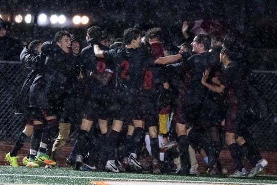 Brophy players celebrate their second goal over Hamilton in the 6A State Championship game in Gilbert, Thursday, Feb 21, 2019. Brophy won 3-0. 