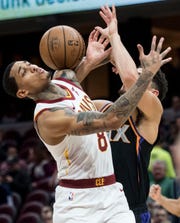 Feb 21, 2019; Cleveland, OH, USA; Cleveland Cavaliers guard Jordan Clarkson (8) and Phoenix Suns guard Devin Booker (1) battle for a loose ball during the first half at Quicken Loans Arena. Mandatory Credit: Ken Blaze-USA TODAY Sports
