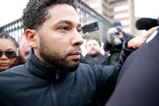 Jussie Smollett leaves Cook County jail after posting bail on Feb. 21.  A judge set his bond $100,000 required the actor to surrender his passport.