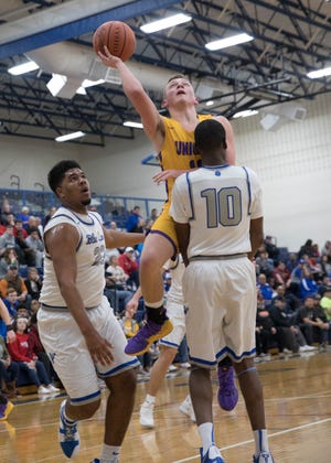 Unioto's Isaac Little puts the ball up during a Division II sectional final at Southeastern High School during the 2018-19 season.