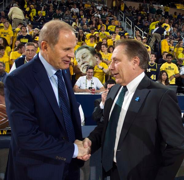 They are rivals on the court, but Michigan’s John Beilein, left, and Michigan State’s Tom Izzo have a cordial relationship.