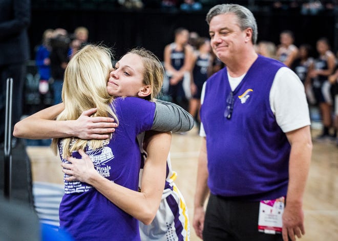 Vincennes Rivet senior Grace Waggoner hugs her mother, Kristi, after receiving the Mental Attitude Award after the Class 1A state championship.