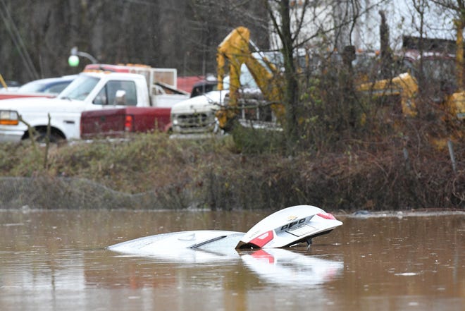 A car is submerged due to flooding at West Emory Road and Sharp Road in Powell Saturday Feb. 23, 2019. The Knoxville area could see between 2 and 3 inches of rain through the weekend.