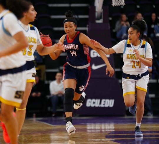 Sahuaro's Alyssa Brown (44) dribbles down the court against Shadow Mountain's Lourdes Kinnard (24) during second half of the 4A girls basketball semifinal game at Grand Canyon University Arena in Phoenix, Ariz. on February 22, 2019. 