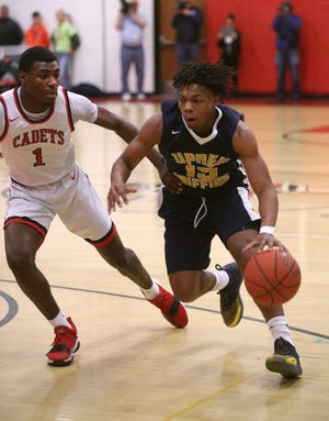 UPrep's Jakhi Lucas (15) is defended by Hilton's Tah'Jae Hill.