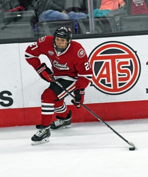 St. Cloud State sophomore Blake Lizotte carries the puck up the ice against Nebraska-Omaha in Friday's game at Baxter Arena.