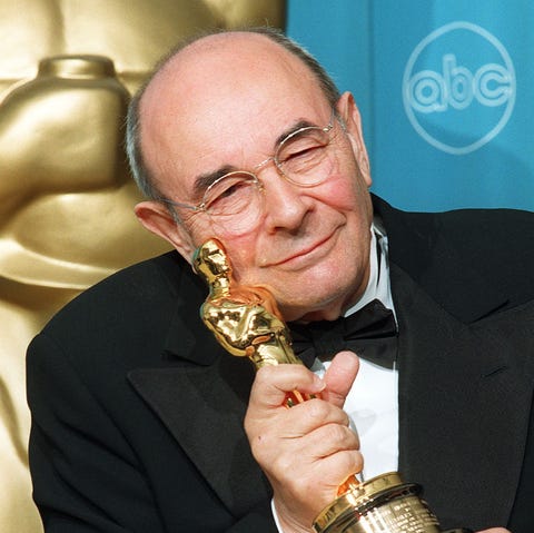 Director Stanley Donen poses with his Oscar for Li
