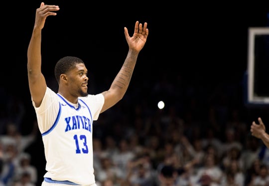 Xavier Musketeers forward Naji Marshall (13) gestures to the crowd to cheer in the second half of the NCAA men's basketball game between Xavier Musketeers and Villanova Wildcats on Saturday, Feb. 24, 2019, at Cintas Center in Cincinnati. Xavier Musketeers defeated Villanova Wildcats 66-54.