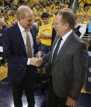 Michigan coach John Beilein, left, and Michigan State coach Tom Izzo chat before the game Sunday, Feb. 24, 2019 at the Crisler Center in Ann Arbor.