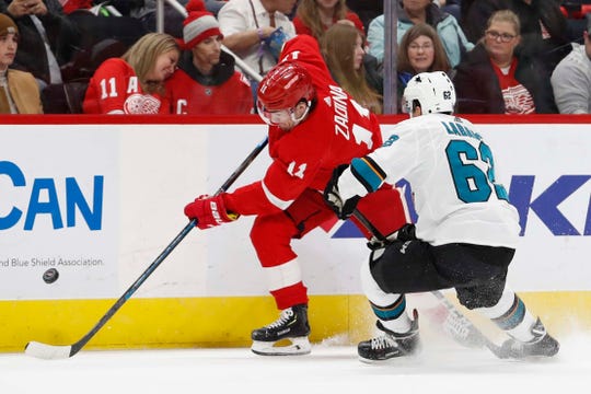Filip Zadina, the right wing of the Red Wings, is defended by right wing Sharks Kevin Labanc in the Wings' 5-3 defeat on Sunday, February 24, 2019, at Little Caesars Arena.