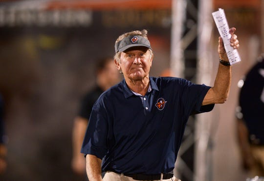 Orlando Apollos head coach Steve Spurrier waves to the crowd as he enters the field before kickoff against the Memphis Express.