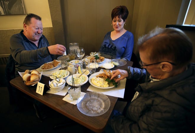 Larry and Kathy Burklund, of Green Bay, have a fish fry dinner with friend Julie Adams, also of Green Bay, at Van Abel's of Hollandtown.