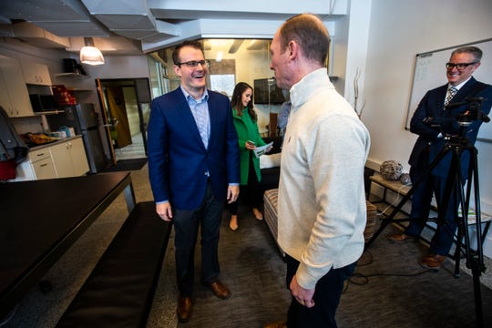 Iowa Lt. Gov. Adam Gregg, left, talks with Rantizo CEO Michael Ott, Monday, Feb. 25, 2019 at Rantizo in Iowa City, Iowa. Rantizo is a targeted drone sprayer company.