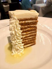 A 10-layer carrot cake at Ocean Prime is stacked on top of creamy pineapple syrup.