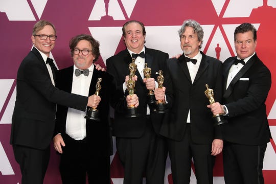 Jim Burke (far left), Charles B. Wessler, Nick Vallelonga, Peter Farrelly and Brian Hayes Currie pose with their best picture Oscars for 'Green Book.'