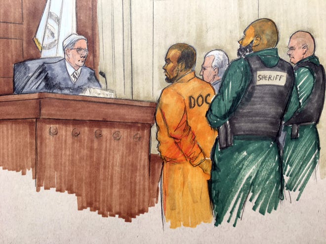 In this courtroom sketch, singer R. Kelly stands before Cook County Associate Judge Lawrence Flood during his arraignment Monday. Flood will be presiding over his case from this point on.