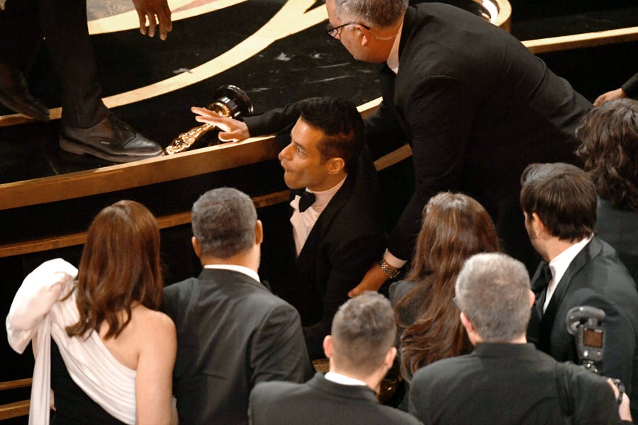 Rami Malek takes a tumble at the Academy Awards on Feb. 24, 2019.
