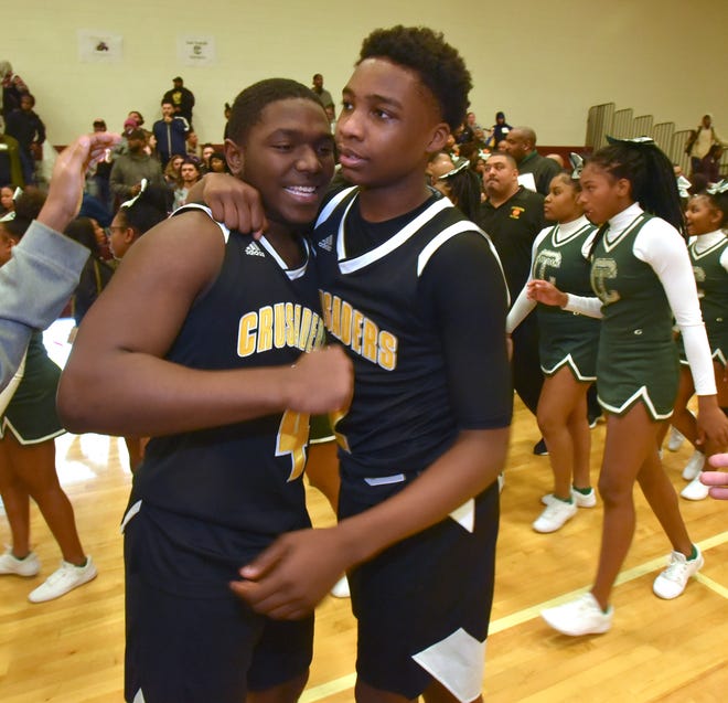 Detroit King teammates Keith Tate and Chancey Willis congratulate each other after their win over Detroit Cass Tech.