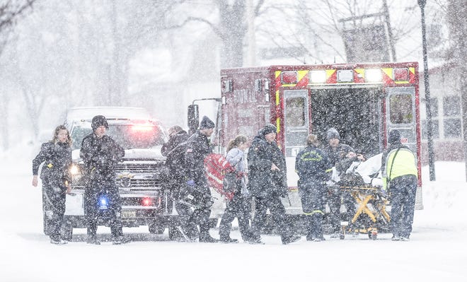 Fond du Lac Police officers secure a scene while Fond du Lac Fire/Rescue personel load a person who was shot in the leg Tuesday, February 26, 2019 on Lincoln Avenue, north of Division Street in Fond du Lac, Wis. Doug Raflik/USA TODAY NETWORK-Wisconsin