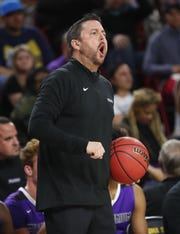 Millennium head coach Ty Amundsen directs his team against Gilbert during the Boys State 5A Championship game in Tempe, Ariz. Feb. 25, 2019.