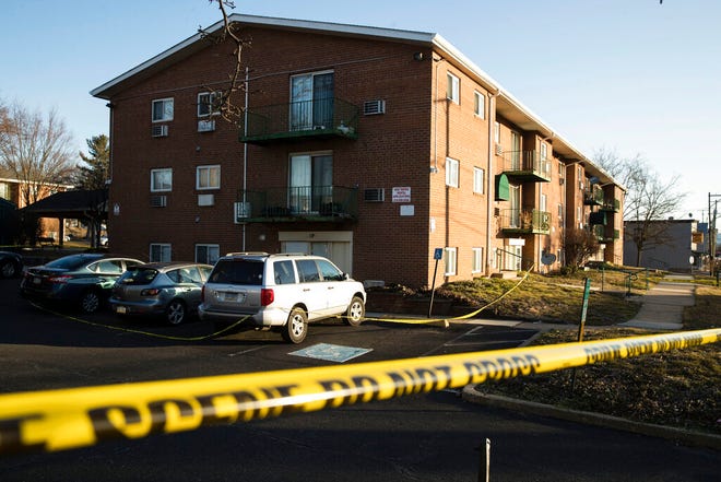 Crime scene tape surrounds the Robert Morris Apartments in Morrisville, Pa., Tuesday, Feb. 26, 2019. A woman and her teenage daughter are facing homicide charges in the deaths of five relatives, including three children, inside an apartment at the complex in suburban Philadelphia, according to authorities. (AP Photo/Matt Rourke)