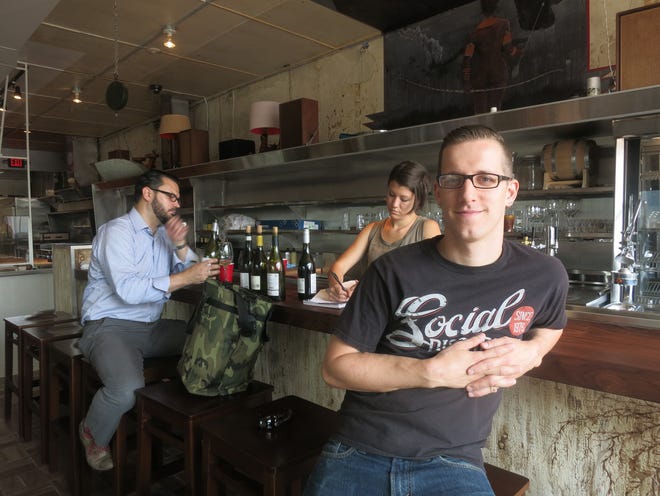 Chef-owner James Rigato pauses at the bar of his new Hazel Park restaurant, Mabel Gray.