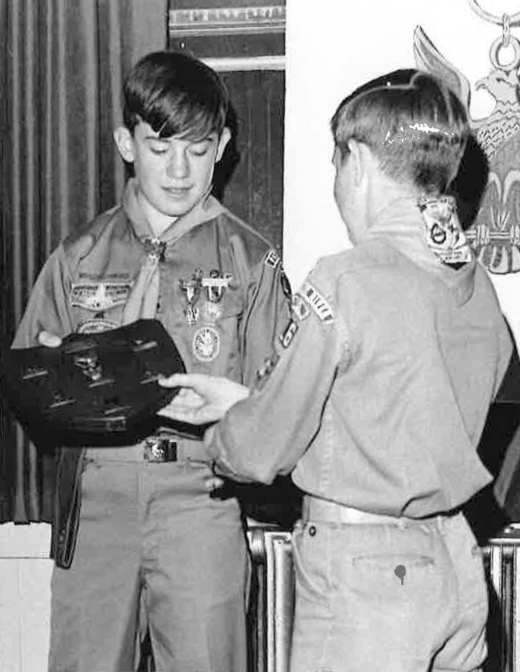 Michael Crow (left) receives his Eagle Scout badge in Maryland in 1969.